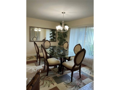 Beautifully Updated GOLF COURSE Frontage Home with the ABSOLUTE on Village Green Golf Club of Sarasota in Florida - for sale on GolfHomes.com, golf home, golf lot