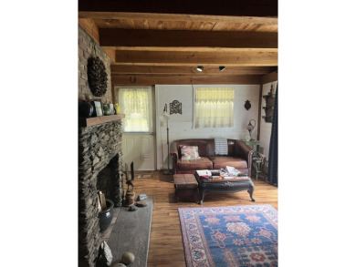 Welcome Home! Located on 10.05 acres, this 4 bedroom, 2 bath on Lake St. Catherine Country Club in Vermont - for sale on GolfHomes.com, golf home, golf lot