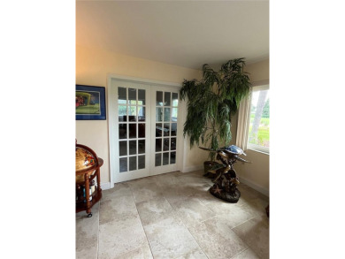 Beautifully Updated GOLF COURSE Frontage Home with the ABSOLUTE on Village Green Golf Club of Sarasota in Florida - for sale on GolfHomes.com, golf home, golf lot