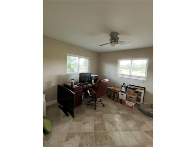 Beautifully Updated GOLF COURSE Frontage Home with the ABSOLUTE on Village Green Golf Club of Sarasota in Florida - for sale on GolfHomes.com, golf home, golf lot