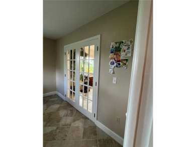 Beautifully Updated GOLF COURSE Frontage Home with the ABSOLUTE on Village Green Golf Club of Sarasota in Florida - for sale on GolfHomes.com, golf home, golf lot