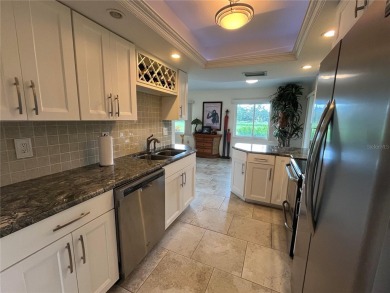 Beautifully Updated GOLF COURSE Frontage Home with the ABSOLUTE on Village Green Golf Club of Sarasota in Florida - for sale on GolfHomes.com, golf home, golf lot