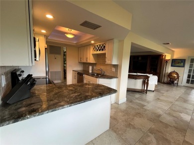 Beautifully Updated GOLF COURSE Frontage Home with the ABSOLUTE on Village Green Golf Club of Sarasota in Florida - for sale on GolfHomes.com, golf home, golf lot