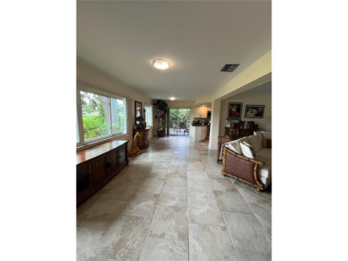 Beautifully Updated GOLF COURSE Frontage Home with the ABSOLUTE on Village Green Golf Club of Sarasota in Florida - for sale on GolfHomes.com, golf home, golf lot