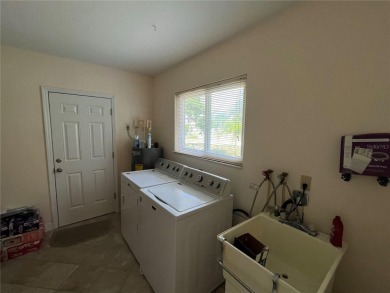 Beautifully Updated GOLF COURSE Frontage Home with the ABSOLUTE on Village Green Golf Club of Sarasota in Florida - for sale on GolfHomes.com, golf home, golf lot