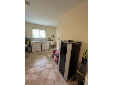 Beautifully Updated GOLF COURSE Frontage Home with the ABSOLUTE on Village Green Golf Club of Sarasota in Florida - for sale on GolfHomes.com, golf home, golf lot