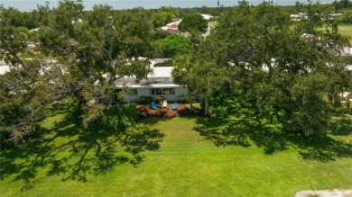 Beautifully Updated GOLF COURSE Frontage Home with the ABSOLUTE on Village Green Golf Club of Sarasota in Florida - for sale on GolfHomes.com, golf home, golf lot