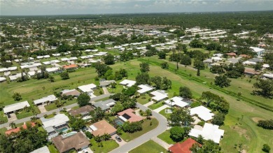 Beautifully Updated GOLF COURSE Frontage Home with the ABSOLUTE on Village Green Golf Club of Sarasota in Florida - for sale on GolfHomes.com, golf home, golf lot