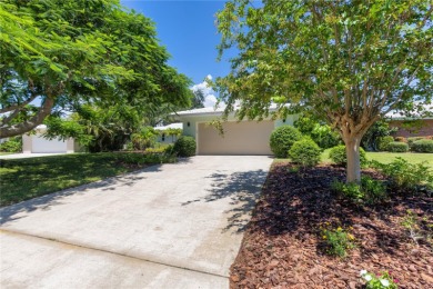 Beautifully Updated GOLF COURSE Frontage Home with the ABSOLUTE on Village Green Golf Club of Sarasota in Florida - for sale on GolfHomes.com, golf home, golf lot