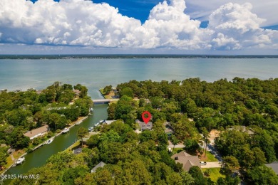 Welcome to this beautifully maintained 4-bedroom, 2-bath coastal on The Country Club of the Crystal Coast in North Carolina - for sale on GolfHomes.com, golf home, golf lot