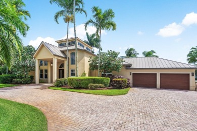 Tucked away on a quiet cul-de-sac in one of Palm Beach Gardens' on BallenIsles Golf and Country Club in Florida - for sale on GolfHomes.com, golf home, golf lot