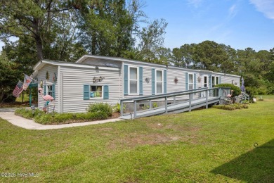 Welcome to your dream retreat in the serene community of Topsail on Topsail Green Golf Club in North Carolina - for sale on GolfHomes.com, golf home, golf lot