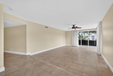 LIGHT AND SPACIOUS, FIRST FLOOR CORNER UNIT IN POPULAR 55+ on BallenIsles Golf and Country Club in Florida - for sale on GolfHomes.com, golf home, golf lot