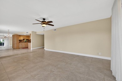 LIGHT AND SPACIOUS, FIRST FLOOR CORNER UNIT IN POPULAR 55+ on BallenIsles Golf and Country Club in Florida - for sale on GolfHomes.com, golf home, golf lot