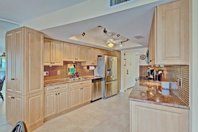 LIGHT AND SPACIOUS, FIRST FLOOR CORNER UNIT IN POPULAR 55+ on BallenIsles Golf and Country Club in Florida - for sale on GolfHomes.com, golf home, golf lot