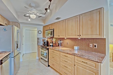 LIGHT AND SPACIOUS, FIRST FLOOR CORNER UNIT IN POPULAR 55+ on BallenIsles Golf and Country Club in Florida - for sale on GolfHomes.com, golf home, golf lot