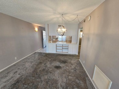 ** REDUCED PRICE ** Great water view from this 2nd floor villa on Isla Del Sol Yacht and Country Club in Florida - for sale on GolfHomes.com, golf home, golf lot