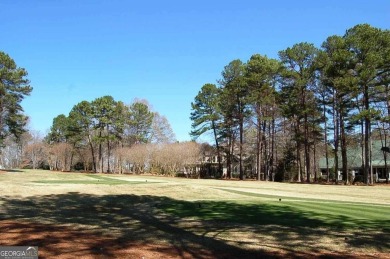 Beautiful level lot overlooking #16 fairway/tee boxes/lake view S on Great Waters Course At Reynolds Plantation in Georgia - for sale on GolfHomes.com, golf home, golf lot