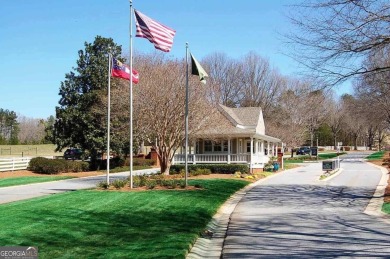 Beautiful level lot overlooking #16 fairway/tee boxes/lake view S on Great Waters Course At Reynolds Plantation in Georgia - for sale on GolfHomes.com, golf home, golf lot