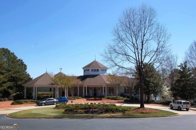 Beautiful level lot overlooking #16 fairway/tee boxes/lake view on Great Waters Course At Reynolds Plantation in Georgia - for sale on GolfHomes.com, golf home, golf lot