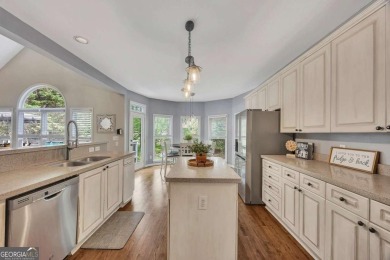 Perfectly positioned on the fairway of the par-5 2nd hole in the on Towne Lake Hills Golf Club in Georgia - for sale on GolfHomes.com, golf home, golf lot
