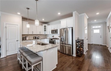 As you step inside, notice the LVP flooring  recessed lighting on Colonial Heritage Golf Club in Virginia - for sale on GolfHomes.com, golf home, golf lot