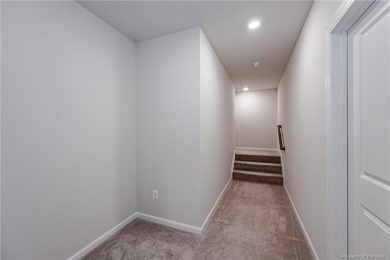 As you step inside, notice the LVP flooring  recessed lighting on Colonial Heritage Golf Club in Virginia - for sale on GolfHomes.com, golf home, golf lot