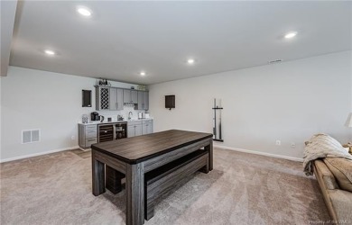 As you step inside, notice the LVP flooring  recessed lighting on Colonial Heritage Golf Club in Virginia - for sale on GolfHomes.com, golf home, golf lot