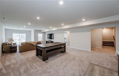 As you step inside, notice the LVP flooring  recessed lighting on Colonial Heritage Golf Club in Virginia - for sale on GolfHomes.com, golf home, golf lot