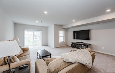 As you step inside, notice the LVP flooring  recessed lighting on Colonial Heritage Golf Club in Virginia - for sale on GolfHomes.com, golf home, golf lot