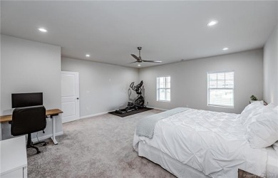 As you step inside, notice the LVP flooring  recessed lighting on Colonial Heritage Golf Club in Virginia - for sale on GolfHomes.com, golf home, golf lot