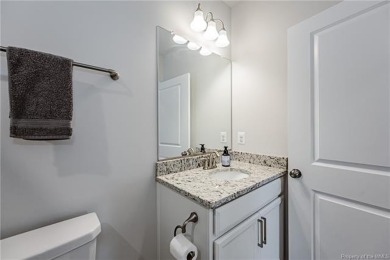 As you step inside, notice the LVP flooring  recessed lighting on Colonial Heritage Golf Club in Virginia - for sale on GolfHomes.com, golf home, golf lot