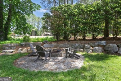 Perfectly positioned on the fairway of the par-5 2nd hole in the on Towne Lake Hills Golf Club in Georgia - for sale on GolfHomes.com, golf home, golf lot