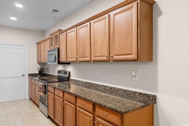 Experience luxury and tranquility in this fully furnished on Barefoot Resort and Golf Club  in South Carolina - for sale on GolfHomes.com, golf home, golf lot
