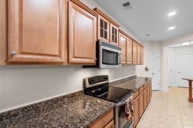 Experience luxury and tranquility in this fully furnished on Barefoot Resort and Golf Club  in South Carolina - for sale on GolfHomes.com, golf home, golf lot