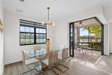 STUNNING 2-BEDROOM + DEN COACH HOME WITH BREATHTAKING WATER & on Esplanade Golf and  Country Club in Florida - for sale on GolfHomes.com, golf home, golf lot