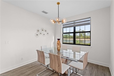 STUNNING 2-BEDROOM + DEN COACH HOME WITH BREATHTAKING WATER & on Esplanade Golf and  Country Club in Florida - for sale on GolfHomes.com, golf home, golf lot