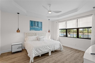 STUNNING 2-BEDROOM + DEN COACH HOME WITH BREATHTAKING WATER & on Esplanade Golf and  Country Club in Florida - for sale on GolfHomes.com, golf home, golf lot