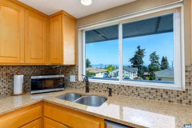 This beautifully maintained 3-bedroom, 3-bathroom residence on Peninsula Golf Club Inc. in Washington - for sale on GolfHomes.com, golf home, golf lot