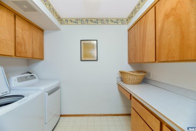 This beautifully maintained 3-bedroom, 3-bathroom residence on Peninsula Golf Club Inc. in Washington - for sale on GolfHomes.com, golf home, golf lot