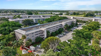 Welcome to your perfect Florida retreat! This beautifully on Wynmoor Golf Course in Florida - for sale on GolfHomes.com, golf home, golf lot