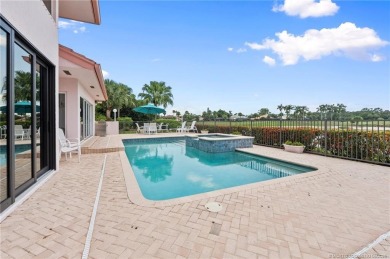 Enjoy natural light and serene views overlooking the lake, pool on Pipers Landing Country Club in Florida - for sale on GolfHomes.com, golf home, golf lot