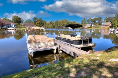 Welcome to this stunning 3-bedroom, 2.5-bathroom waterfront home on Players Course At Wyboo Plantation in South Carolina - for sale on GolfHomes.com, golf home, golf lot