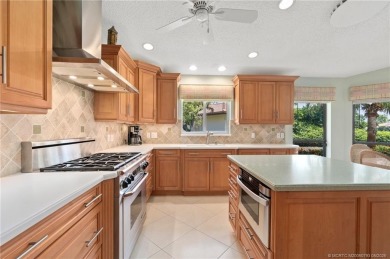 Enjoy natural light and serene views overlooking the lake, pool on Pipers Landing Country Club in Florida - for sale on GolfHomes.com, golf home, golf lot