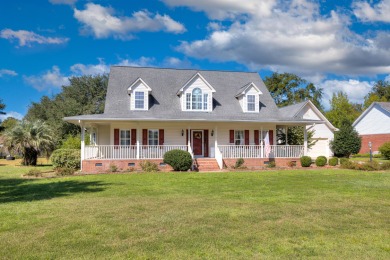 Welcome to this stunning 3-bedroom, 2.5-bathroom waterfront home on Players Course At Wyboo Plantation in South Carolina - for sale on GolfHomes.com, golf home, golf lot
