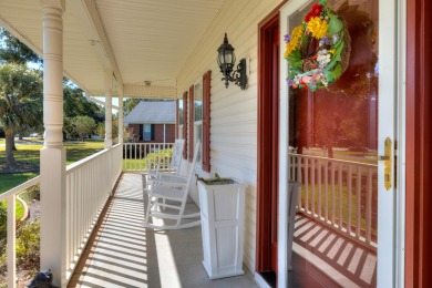 Welcome to this stunning 3-bedroom, 2.5-bathroom waterfront home on Players Course At Wyboo Plantation in South Carolina - for sale on GolfHomes.com, golf home, golf lot