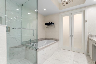 FULLY FURNISHED designer residence at Water Club with on Lost Tree Club in Florida - for sale on GolfHomes.com, golf home, golf lot