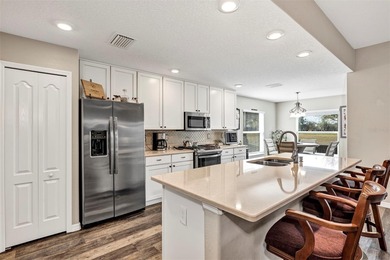 Welcome to a life that feels like vacation every day. Nestled in on Arlington Ridge Golf Club in Florida - for sale on GolfHomes.com, golf home, golf lot