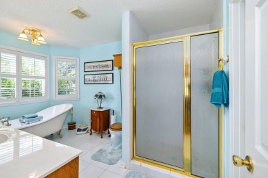 Welcome to this stunning 3-bedroom, 2.5-bathroom waterfront home on Players Course At Wyboo Plantation in South Carolina - for sale on GolfHomes.com, golf home, golf lot