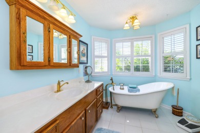 Welcome to this stunning 3-bedroom, 2.5-bathroom waterfront home on Players Course At Wyboo Plantation in South Carolina - for sale on GolfHomes.com, golf home, golf lot